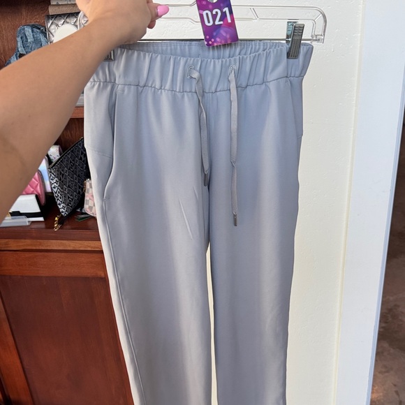 21. Lululemon on the fly ankle Pants - Picture 2 of 2